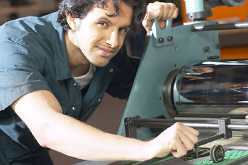 A Man Working At Printing Press